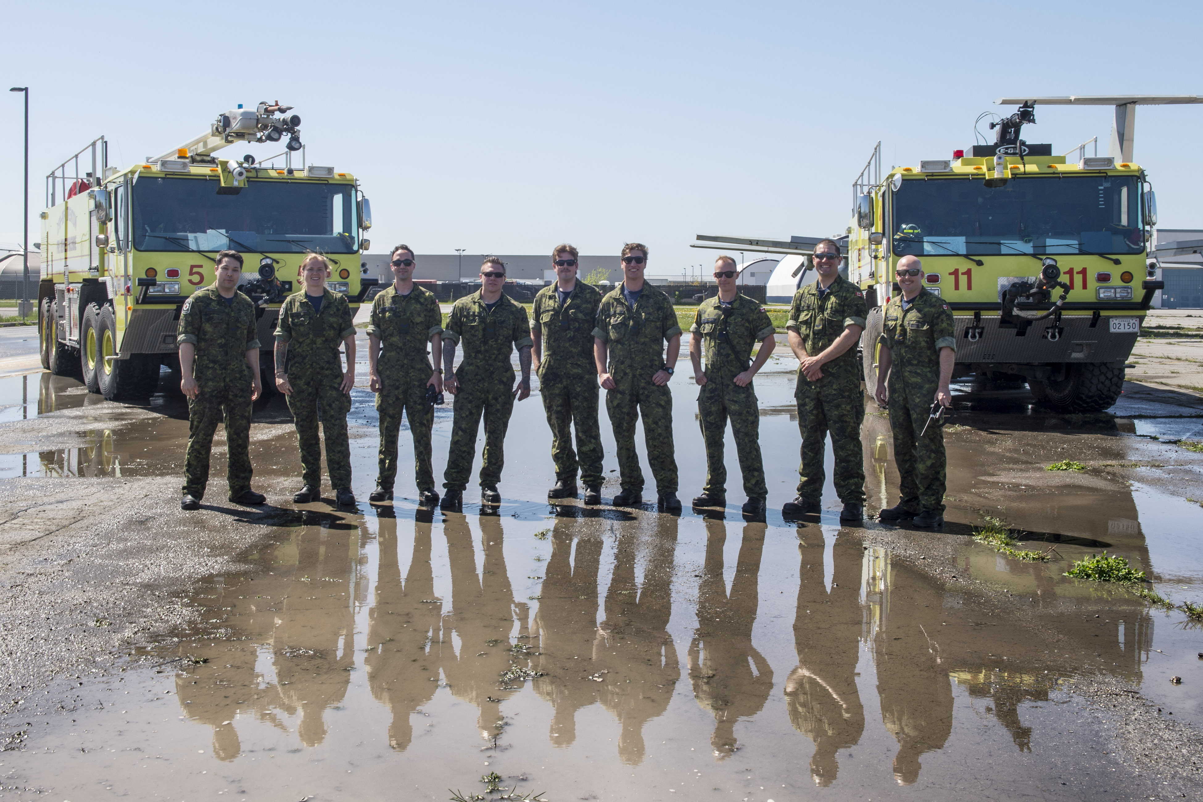 The firefighters of 85 Aircraft Rescue Firefighting fire hall at 8 Wing in Trenton, Ontario. 
From left to right: Aviator Taylor Bergen, Aviator Teresa Dalton, Corporal Grant Finnigan, Corporal Samual Norton, Aviator Andrew Scott, Corporal Chase Duke, Sergeant Jonathan Boudreau, Corporal Byron Freiter, and Corporal Joshua Dwyer.