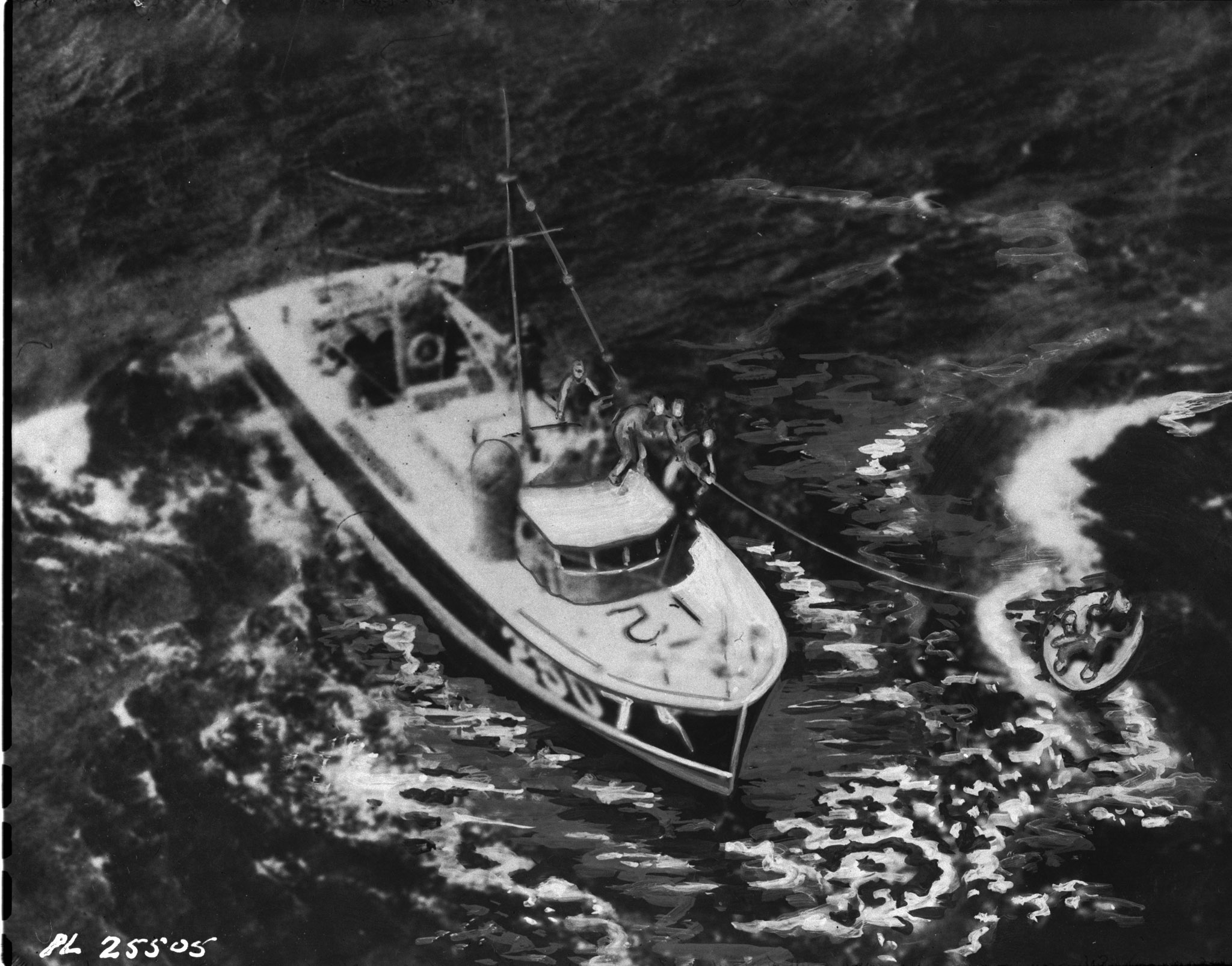 This retouched photograph shows an air-sea-rescue launch hauling to safety survivors of the Royal Canadian Air Force Canso "C for Charlie" who spent 21 hours in the stormy North Atlantic after sinking a German submarine. Badly damaged by the subs guns, the burning plane, piloted by Flight Lieutenant David Hornell was forced into the sea. The crew of eight could not crowd into the one serviceable rubber dinghy and took turns clinging to the side. Sergeant Donald Scott and Sergeant Fernand St. Laurent died of exposure before help came. Flight Lieutenant Hornell died a few minutes after this picture was taken and was posthumously awarded the Victoria Cross. Other members of the crew, all of whom were honoured for their heroic exploit were Flying Officer Bernard Denomy, Flying Officer Graham Campbell, Flying Officer Sidney E. Matheson, Flight Sergeant Israel J. Bodnoff and Flight Sergeant Sidney Cole. PHOTO: DND Archives, PL-25505