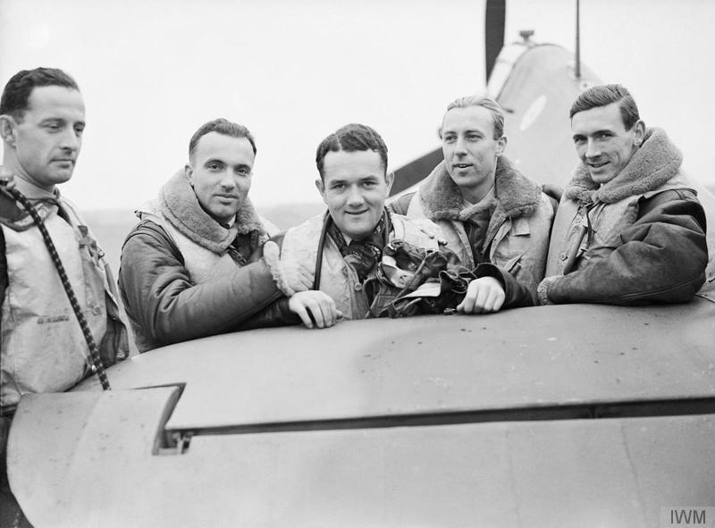 A group of pilots of the Royal Air Force’s No. 303 (Polish) Fighter Squadron stand by one of their Hawker Hurricanes at RAF Leconfield in Yorkshire, on October  24, 1940, late in the Battle of Britain. From left to right are Pilot Officer Miroslaw Ferić, Flying Officer Bogdan Grzeszczak, Pilot Officer Jan Zumbach, Flying Officer Zdzislaw Henneberg and Flight Lieutenant John Kent, a Canadian who commanded the squadron’s 'A' Flight t that time. PHOTO: © Imperial War Museum (CH 1533)