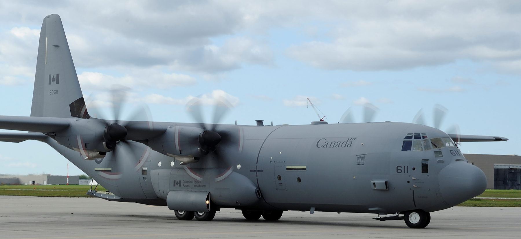 The new RCAF livery will replace the livery shown under the wing of a CC-130J Hercules on RCAF aircraft. The new paint scheme will be added to the aircraft when they undergo regularly scheduled repainting to correct the effects of usage and weather. PHOTO: Corporal Darcy Lefebvre, FA2011-0043-37